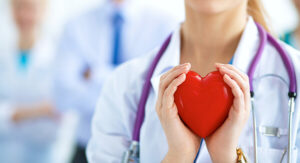 Doctor holding heart in her hands
